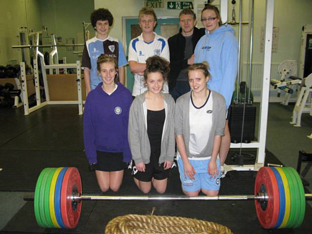 Young athlete receiving coaching during training